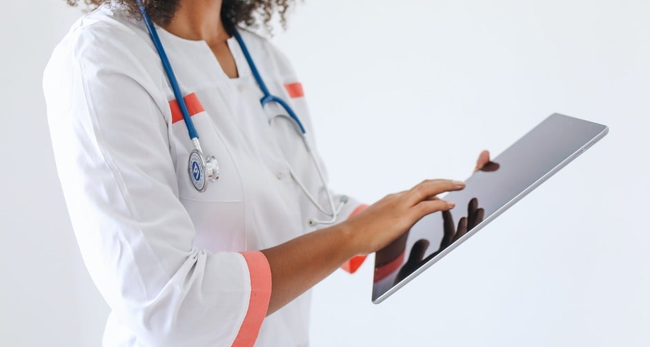 Nurse interacting with tablet